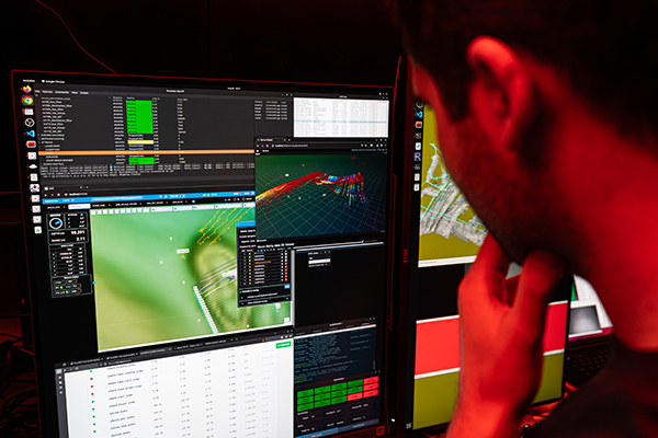 Research Engineer Sebastián Rodríguez examining mapping and navigation data from a new navigation and mapping sensor suite aboard MBARI’s MiniROV-600