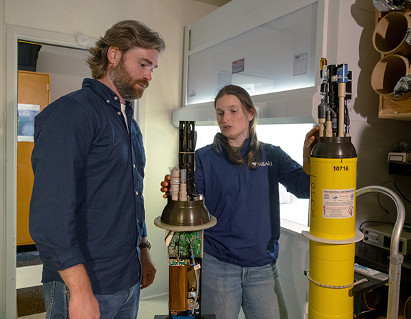 SOCCOM Postdoctoral Fellow Guillaume Liniger (left) and MBARI Research Technician Jessica Metter (right) with a BGC-Argo float