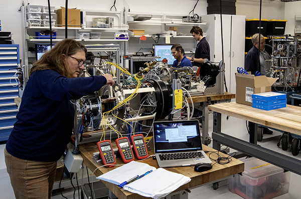 Engineers from MBARI’s SURF Center work in MBARI’s new robotic technology lab